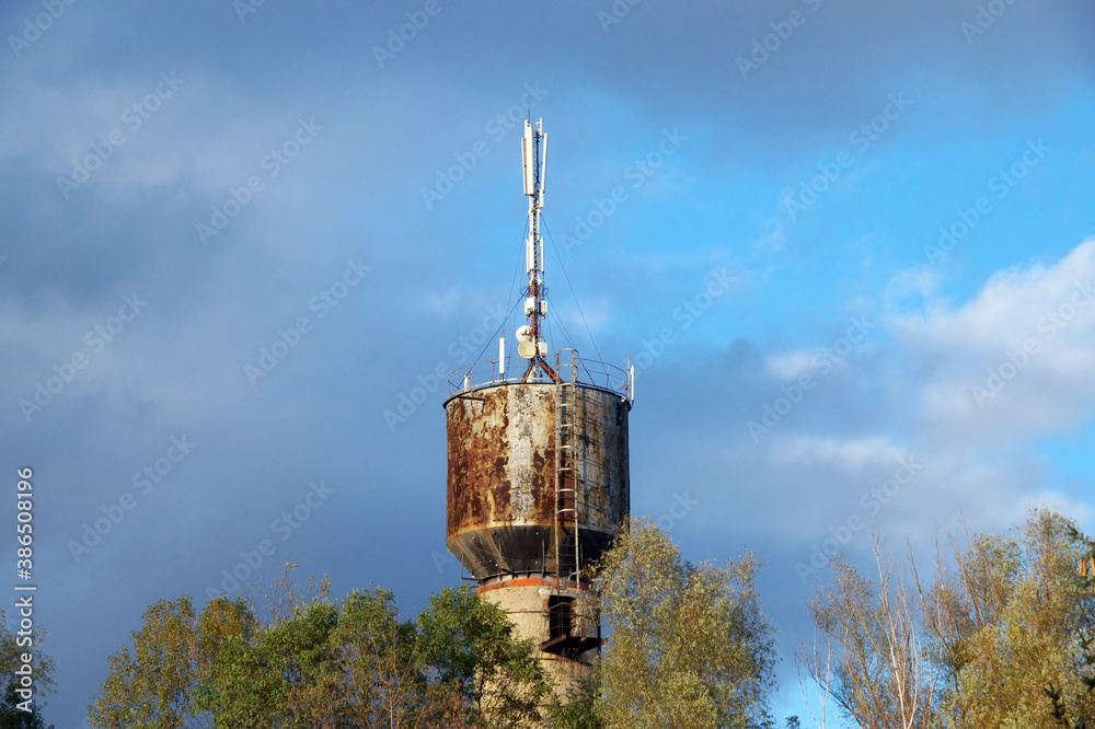 Old water tower with 4G communication antennas.