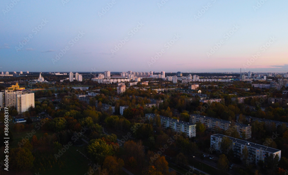 Top view of the outskirts of the city at sunset