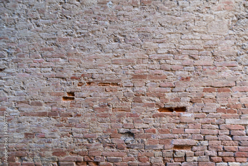 Red brick wall. Scratched old wall. Red bricks