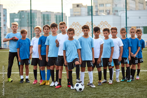 young football players boys ready to play, they divided into groups, going to participate in the competition © Roman