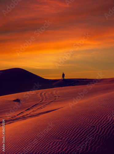 A person walking in the desert.