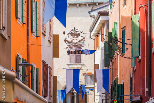 Fototapeta Naklejka Na Ścianę i Meble -  Beautiful colored hous facades in the narrow streets in Garda
