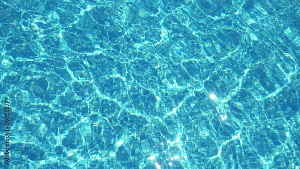 Sparkling waters moving up and down in a paddling pool on sunny day in summer Sparkling waters moving up and down in a paddling pool on sunny day in summer