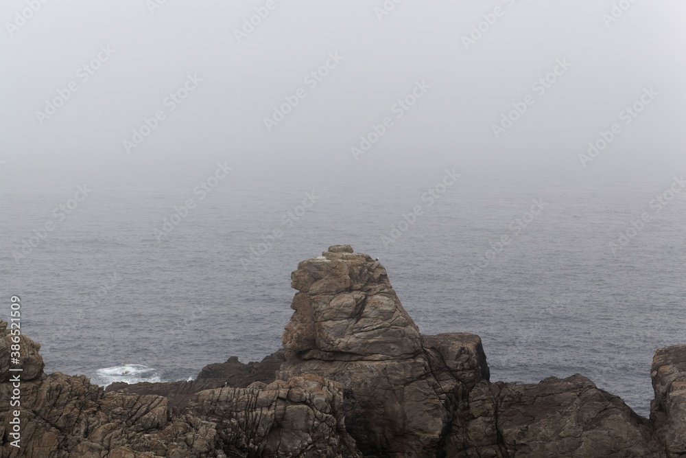 Rocky coast of the island Ouessant, in the fog. Rocky coast of the island Ouessant, in the fog.