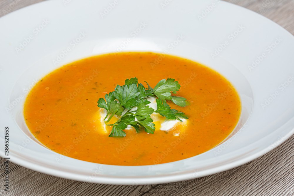 carrot soup in a white bowl carrot soup in a white bowl
