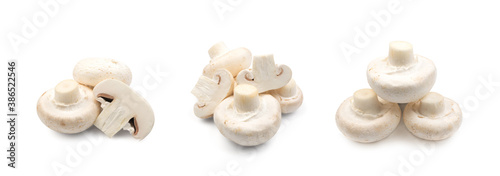 Whole and slised mushrooms piles on white background