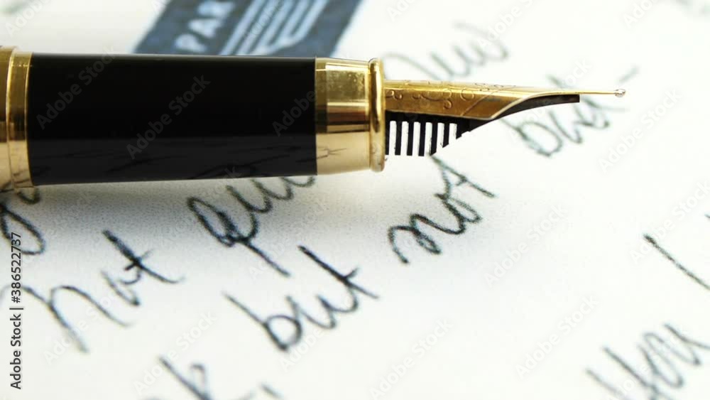 Fountain pen on old letter text dolly shot Fountain pen on old letter text dolly shot