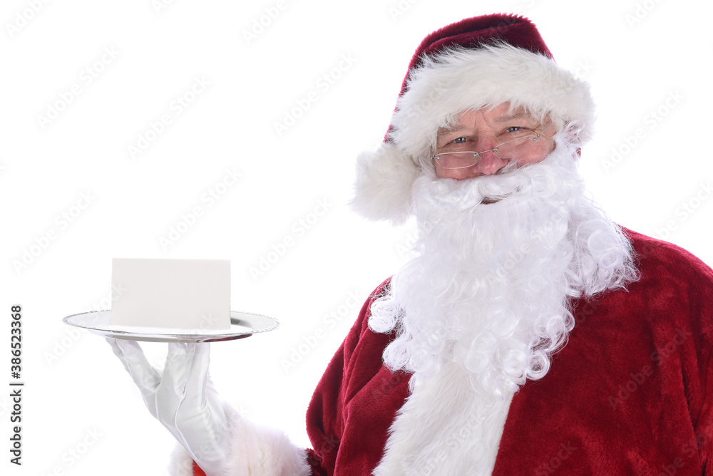 Santa Claus holding a silver platter with a blank note card, isolated on white. Santa Claus holding a silver platter with a blank note card, isolated on white.