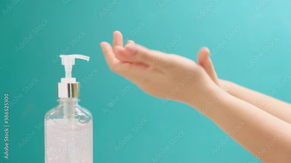 close up of Woman using hand sanitizer gel alcohol for clean hands coronavirus protection.