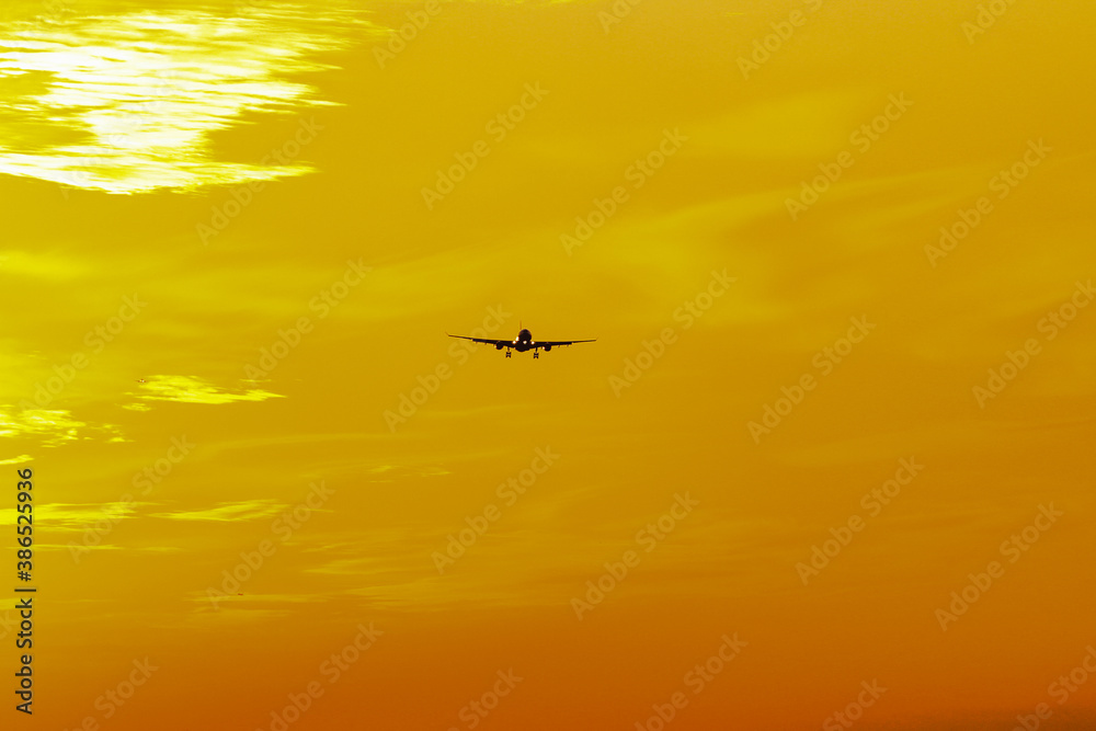 airplane on sunset background