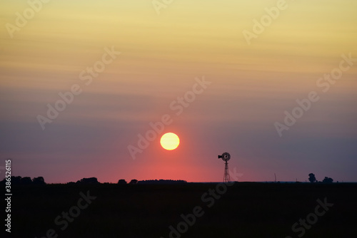 Windmill in countryside at sunset  Pampas  Patagonia Argentina.