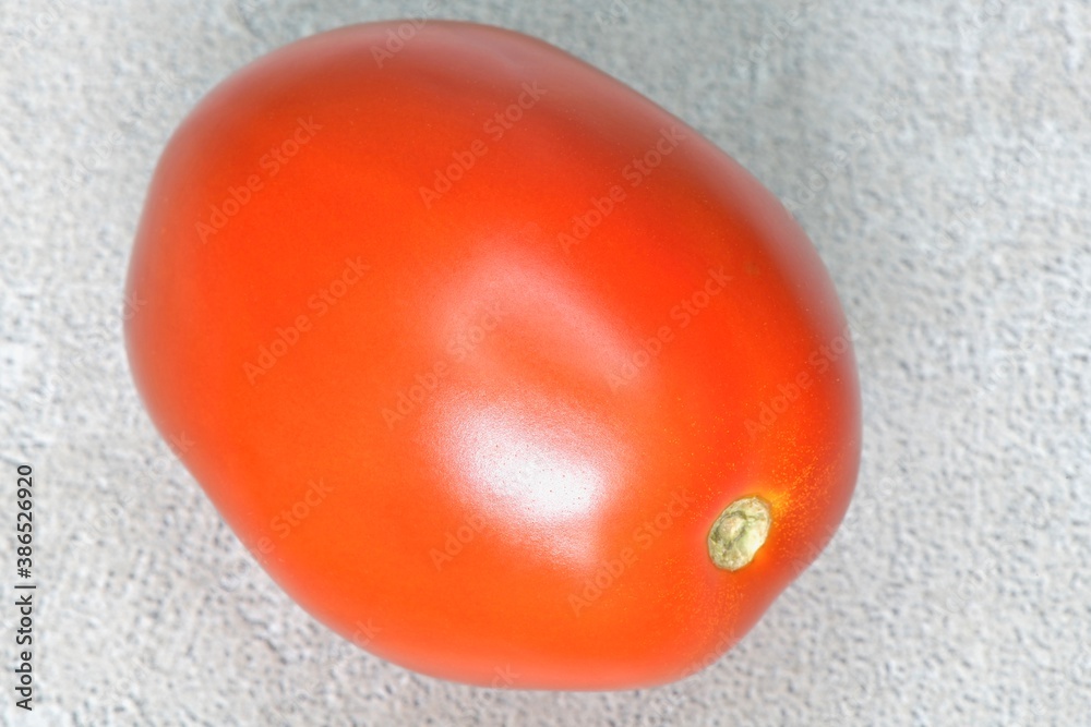 Fresh raw isolated oval tomato Fresh raw isolated oval tomato