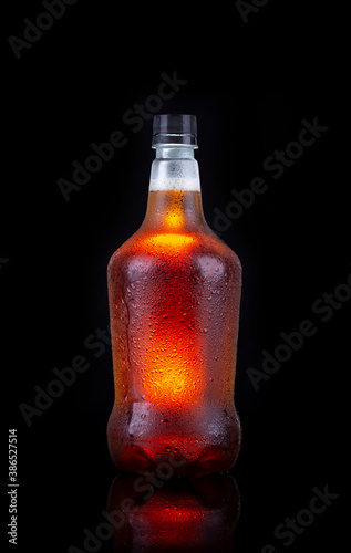 фотографія Beer growler with Inda pale ale inside isolated on black background