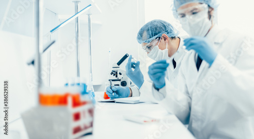 Fototapeta Naklejka Na Ścianę i Meble -  close up. group of scientists testing the results of a new vaccine .