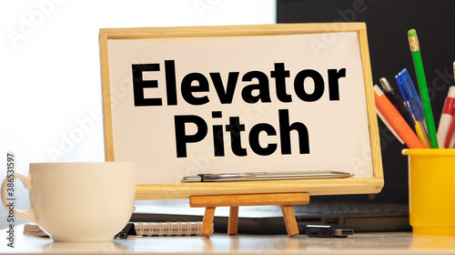 elevator pitch text message on white paper and office supplies, pen, paper note, on white desk