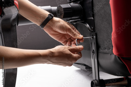 Фотография adjusting or repair office armchair