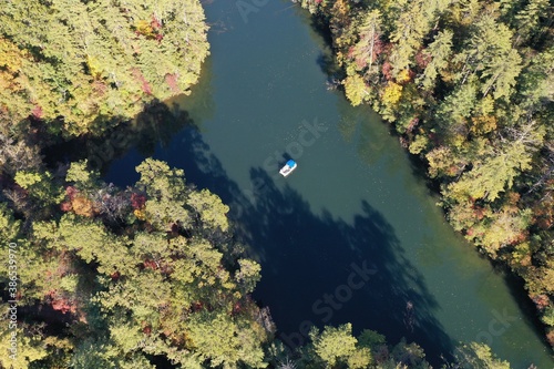 Aerial view of pontoon boat on Lake Santeetlah  North Carolina in autumn.