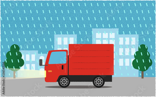 豪雨の中、ライトを点けて都市の道路を進む赤いトラックのベクターイラスト