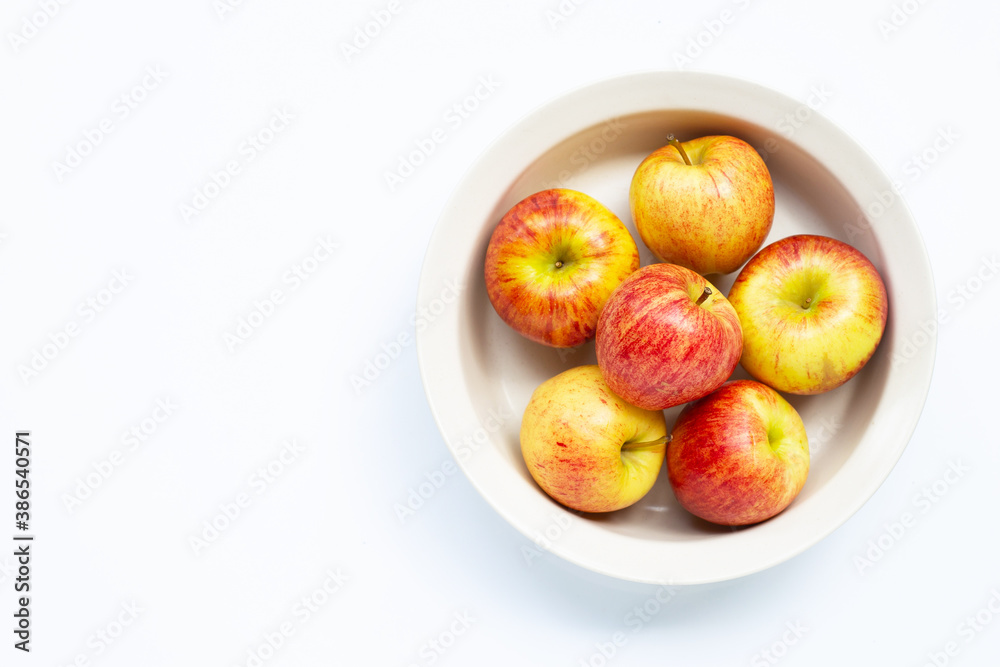 Fresh and juicy apples in bowl on white Fresh and juicy apples in bowl on white