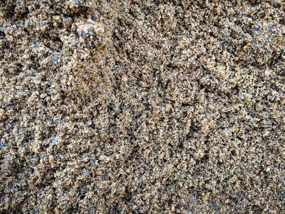 Naklejka premium Detailed texture of coarse sand, top view. Important material in concrete mixing, background image.