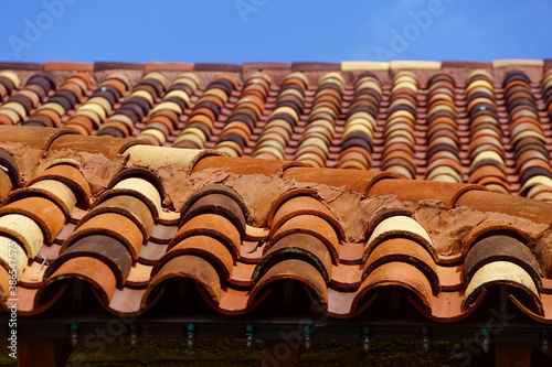 Colorful Spanish clay roof tiles on a building