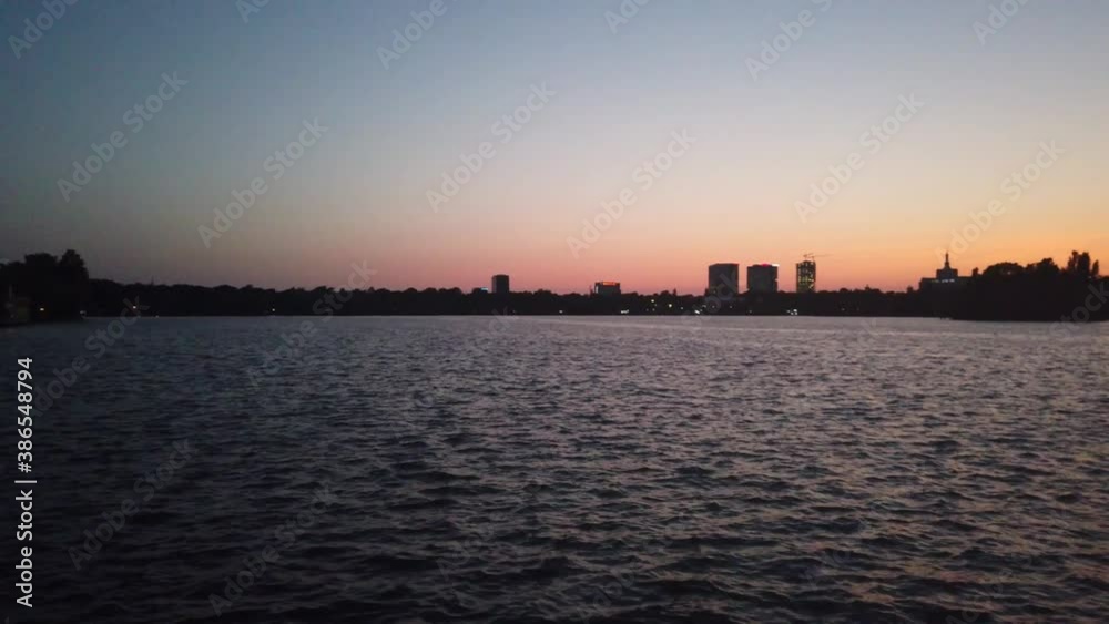 Park Lake waves at sunset. Beautiful calm scenery Park Lake waves at sunset. Beautiful calm scenery