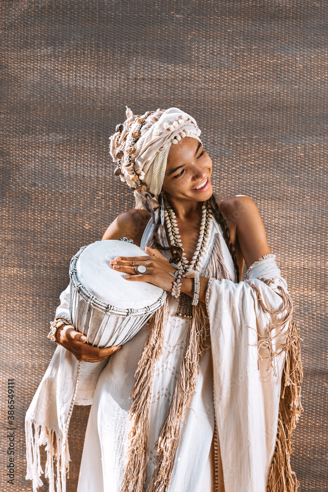Fototapeta beautiful young stylish woman wearing turban and accessories made of sea shells