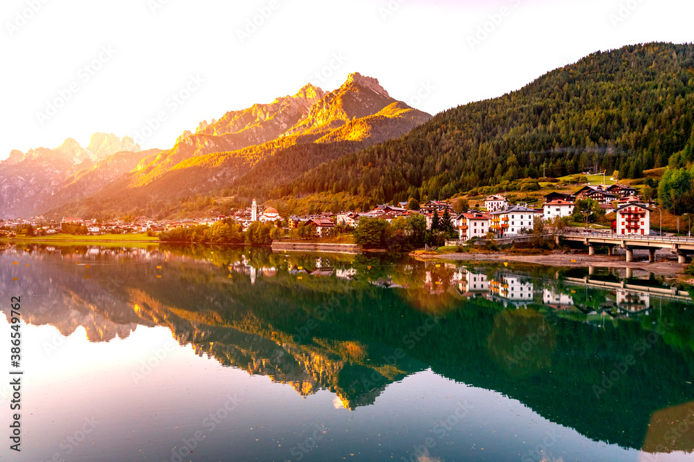 Fototapeta premium A small town on a mountain lake. Alps, Austria.