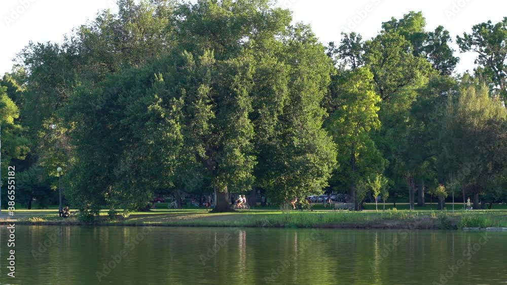 People walking  and biking in Denver City Park