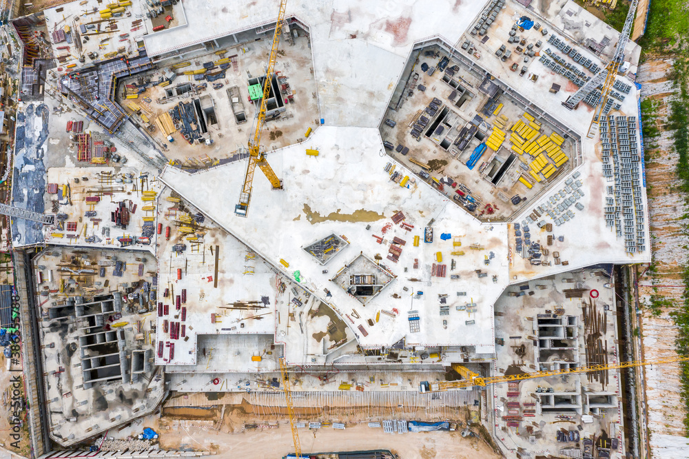 Fototapeta premium large construction site. monolithic frame construction of the building. construction site background. aerial top view