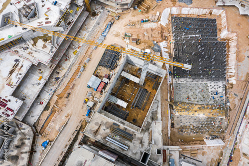 new concrete buildings under construction. urban construction background. aerial view