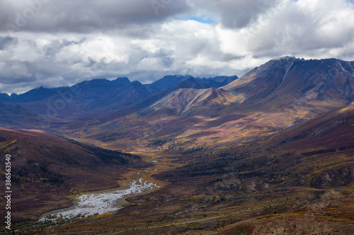 View of Scenic Landscape and Mountains on a Cloudy Day in Canadian Nature. Aerial Shot. Taken in Tombstone Territorial Park, Yukon, Canada.