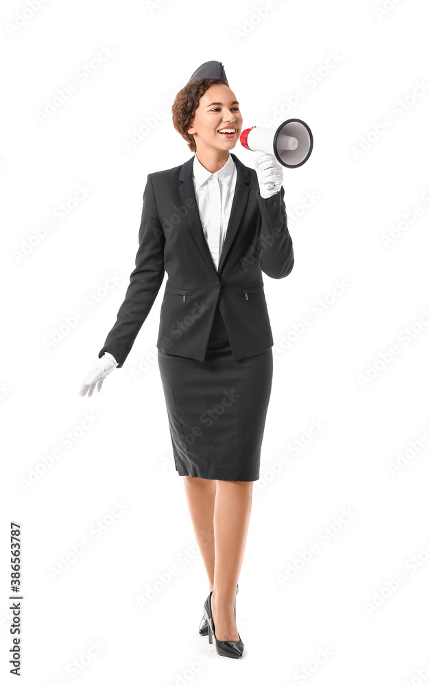 Beautiful African-American stewardess with megaphone on white background Beautiful African-American stewardess with megaphone on white background