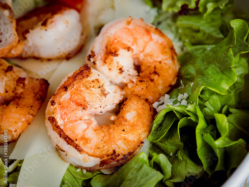 High resolution macro with close up grilled shrimp and lettuce 