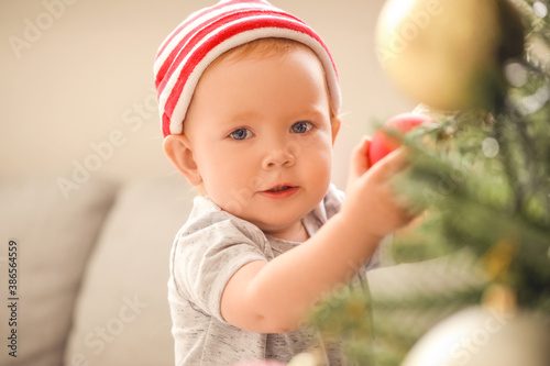 Cute little baby near Chris...
