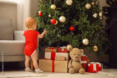 Cute little baby near Chris...