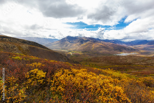 Scenic View of Road  Landscape and Mountains on a Colorful Fall Day in Canadian Nature. Taken in Tombstone Territorial Park  Yukon  Canada.