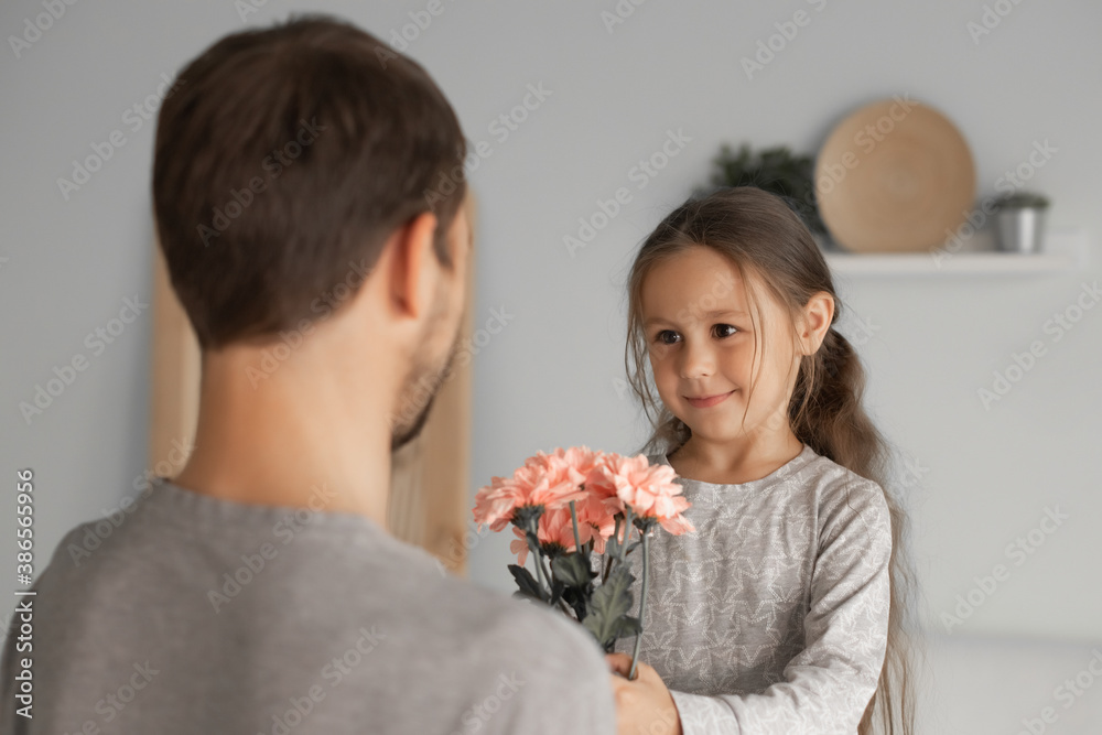 Dad congratulates daughter and gives her flowers Dad congratulates daughter and gives her flowers