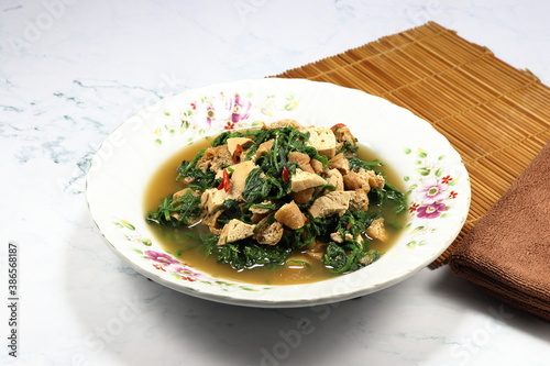 Принти на полотні Fried and stirred spicy fresh Paco Fern with tofu, chilly and basil on the plate