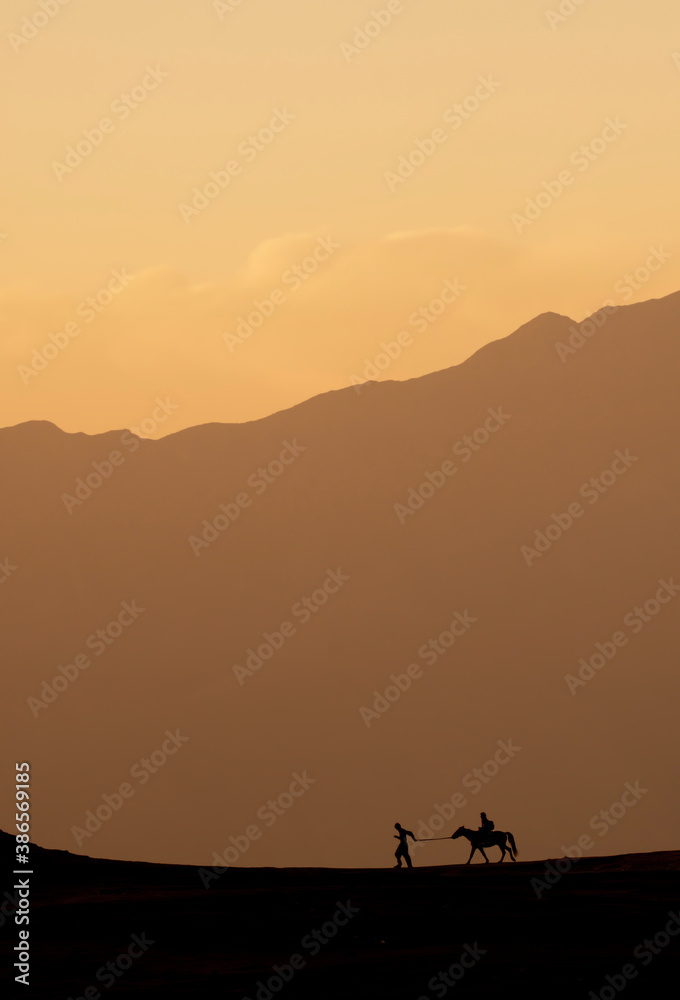 Men in mountains with horse 