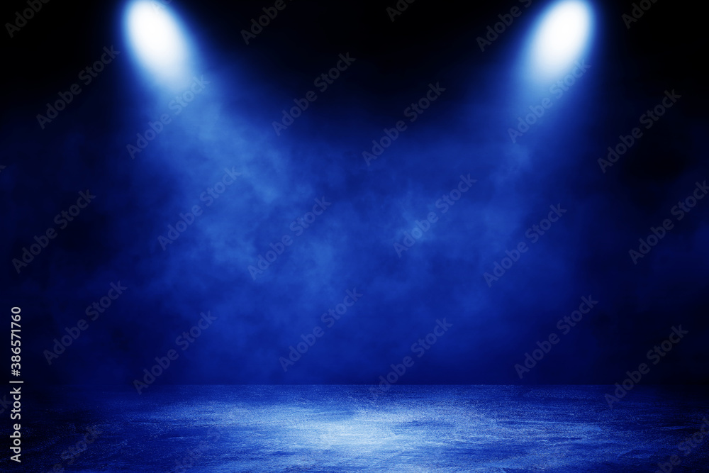 Empty space of Studio dark room concrete floor grunge texture background with blue lighting effect and smoke in background.