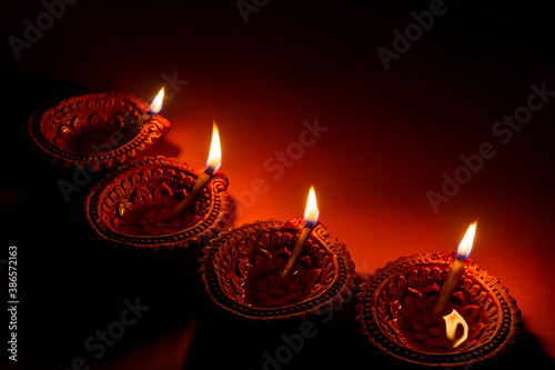 Diya or oil lamps lit during Diwali festival.Happy Diwali