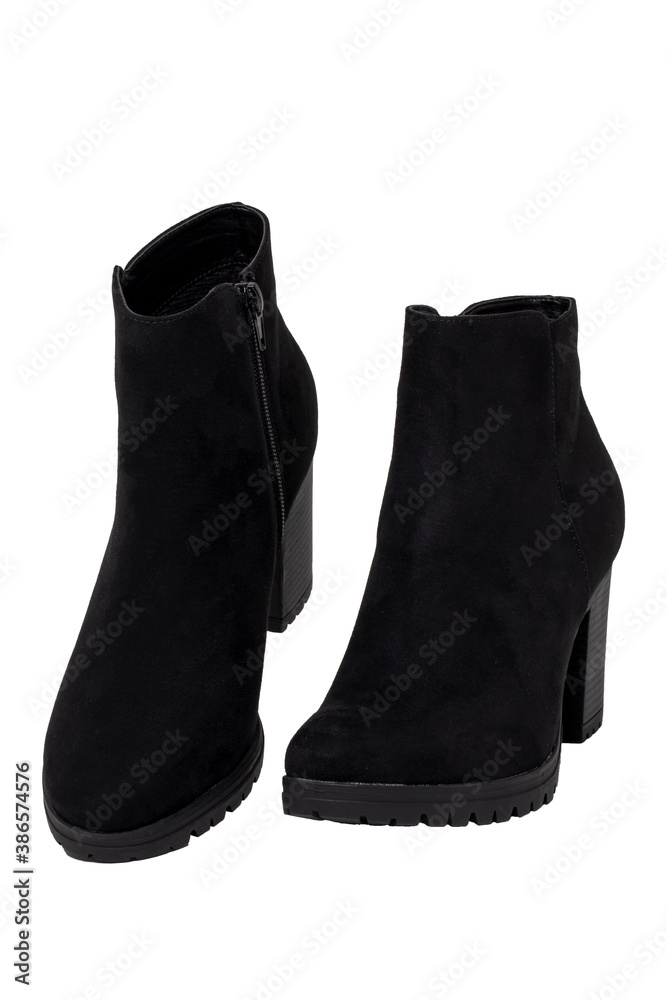 Leather shoes isolated. Close-up of a pair of black classic elegant female suede shoes isolated on a white background. Womans shoe fashion. Macro. Leather shoes isolated. Close-up of a pair of black classic elegant female suede shoes isolated on a white background. Womans shoe fashion. Macro.