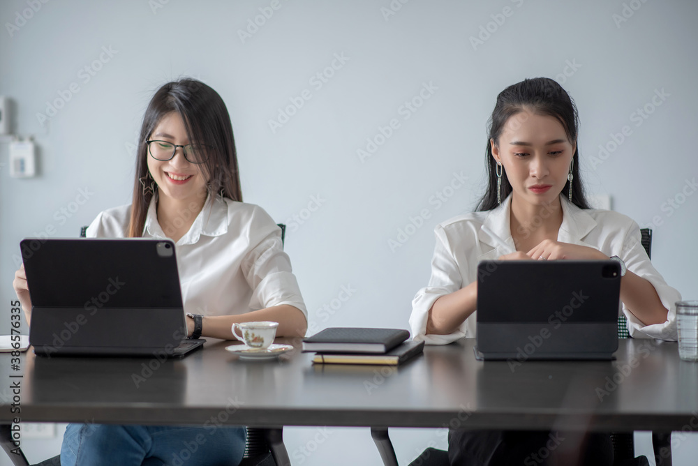 Two young asian woman working together at office modern. Two young asian woman working together at office modern.