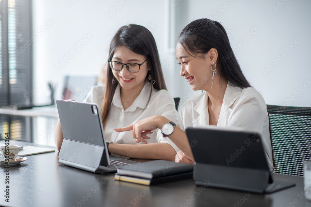 Two young asian woman working together at office modern. Two young asian woman working together at office modern.