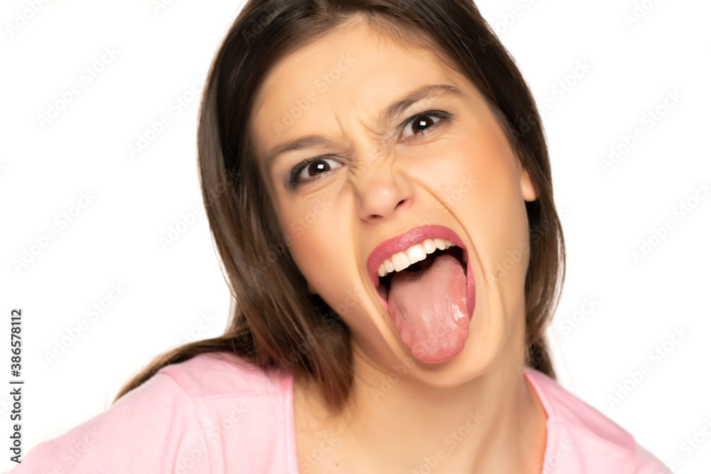 portrait of young funny woman with tongue out portrait of young funny woman with tongue out