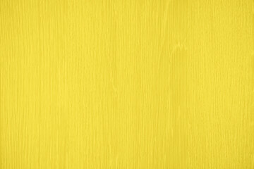 Natural bright yellow wood texture background. Wavy textured plywood, a lot of fiber and small chips, close-up abstract tree background for design, decor and skins. 2021 color trend