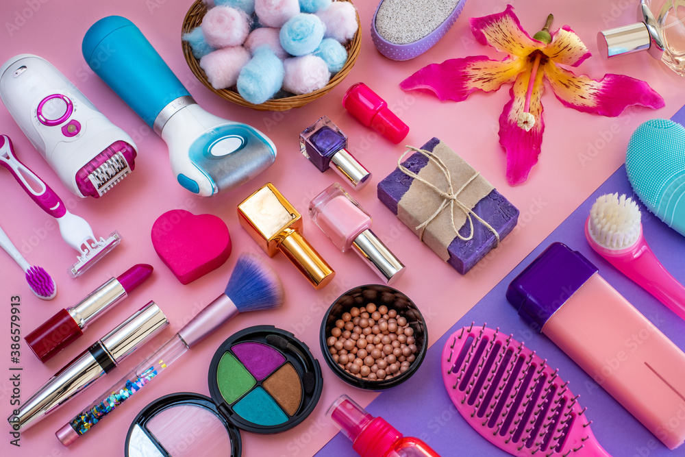 Fototapeta premium Variation of epilation devices and cosmetics on the table