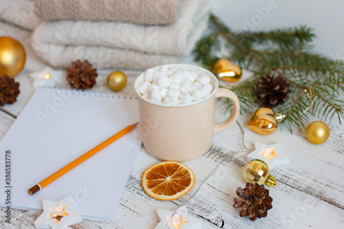 Christmas background  Notepad with pencil  coffee mug and marshmallows   Golden Christmas tree toys . Letter To Santa Claus. Merry Christmas greeting card