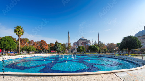 Panoramic view of Hagia Sophia in sunny autumn day from fountain in Sultanahmet Park in Istanbul, Turkey